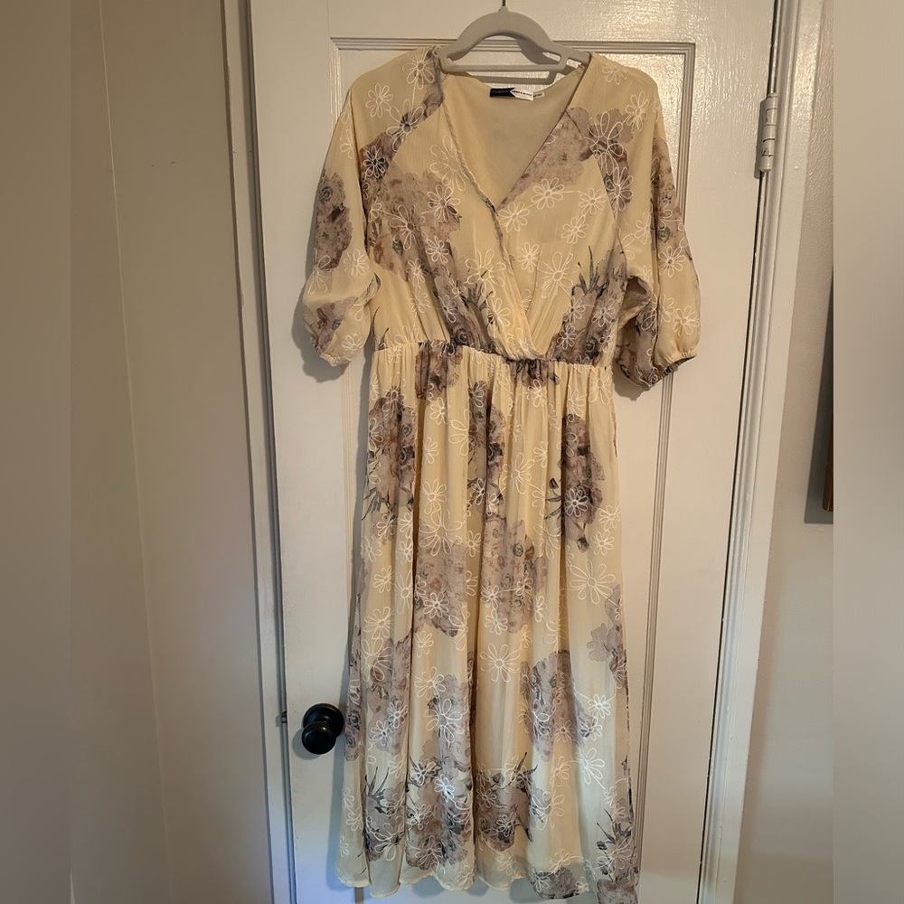 Cream colored dress with flower embroidered detail